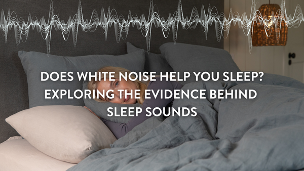 person sleeping in bed listening to white noise