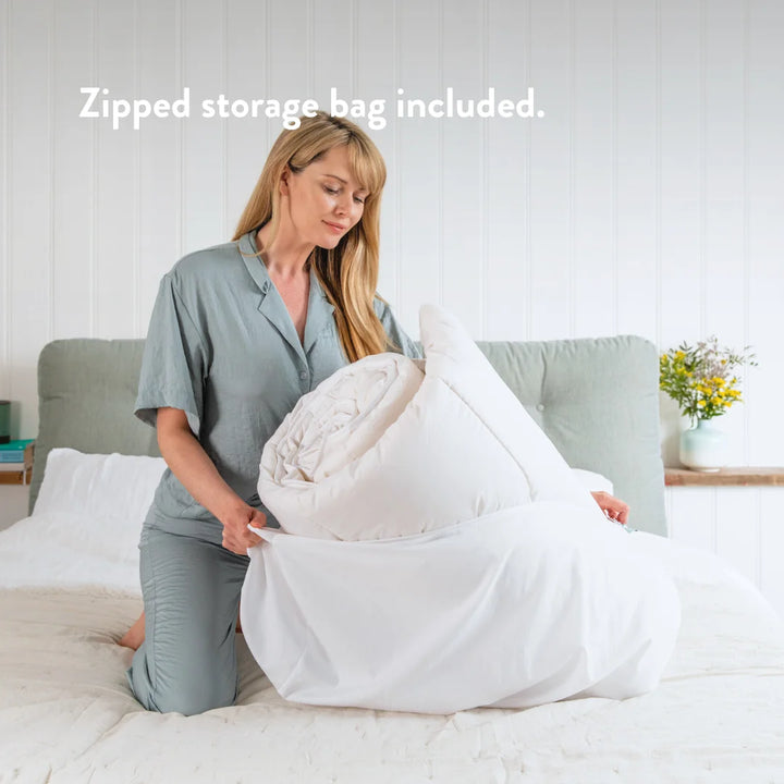 British wool duvet with zipped storage bag included.